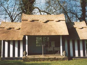 Thatched Out-Building In Water Reed